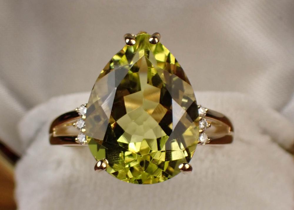 Appraisal: LEMON QUARTZ DIAMOND AND FOURTEEN KARAT GOLD RING with three