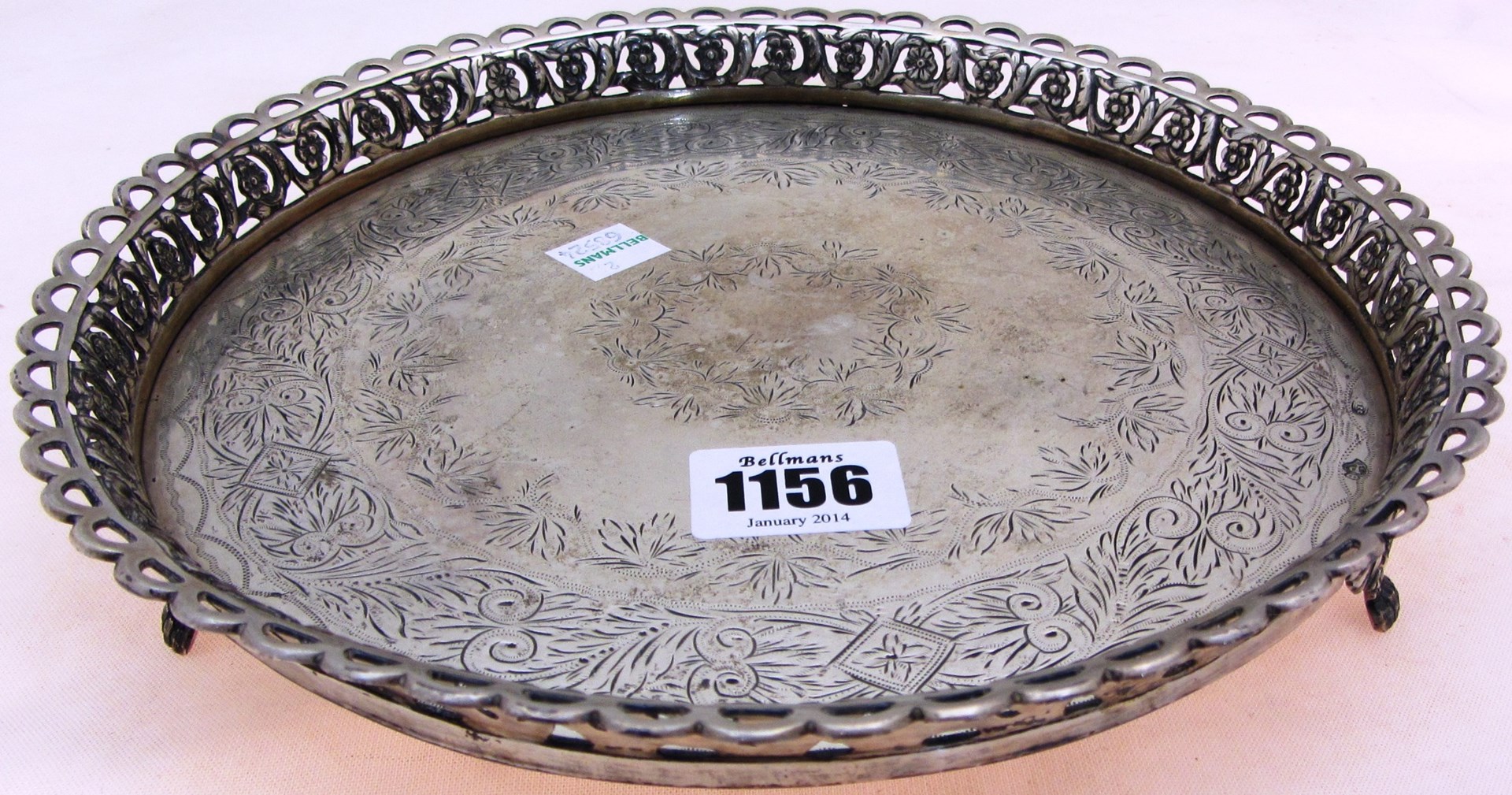 Appraisal: A European circular salver with foliate and scroll engraved decoration