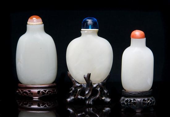 Appraisal: Group of Three Jade Snuff Bottles the first of compressed