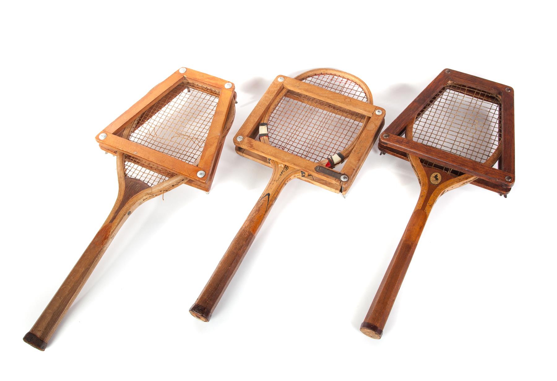 Appraisal: THREE VINTAGE WOODEN TENNIS RACKETS Mid th century Wooden frames