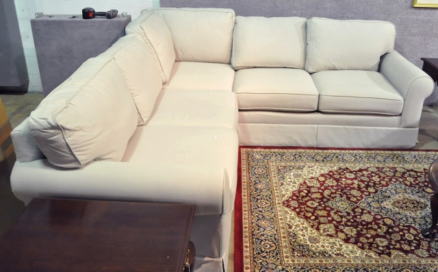 Appraisal: Tuxedo Style Sectional SofaIn beige duck fabric Sofa x loveseat