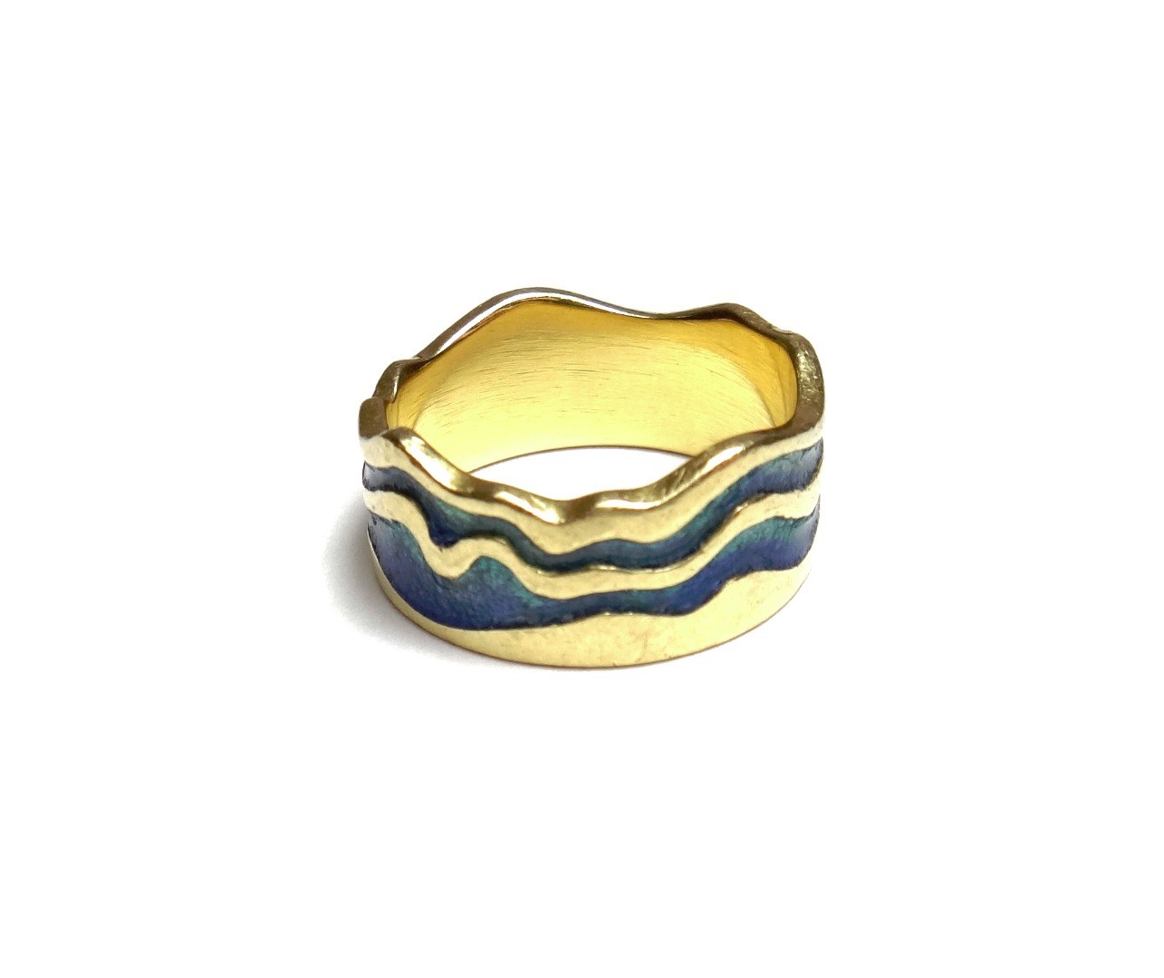 Appraisal: An ct gold and blue green enamelled wide band ring