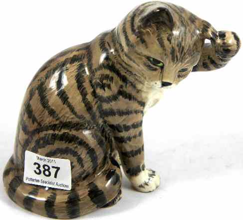 Appraisal: Beswick Seated Cat Scratching Ear in Grey Swiss Roll Decoration