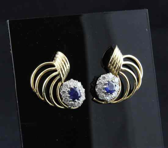 Appraisal: A pair of two colour gold sapphire and diamond cluster