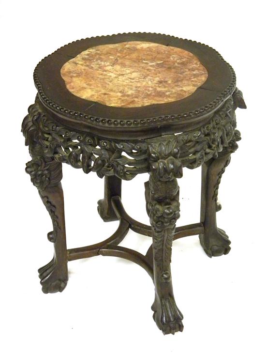 Appraisal: Carved Chinese stand with round rose-colored marble inset top cross