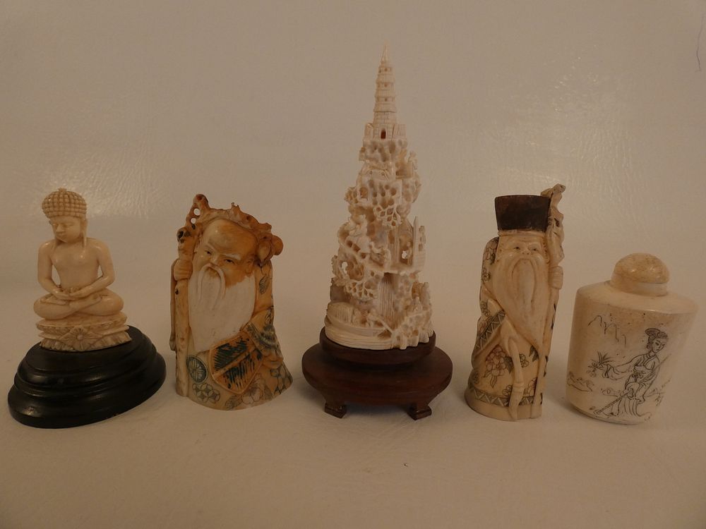 Appraisal: JAPANESE CARVED FIGURES Lot old Japanese carved bone figures to