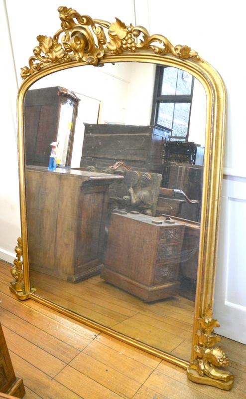 Appraisal: A FRENCH GILT WOOD OVERMANTEL MIRROR WITH A CREST CARVED