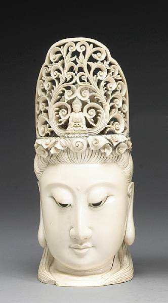 Appraisal: A carved and tinted ivory head of Guanyin Finely carved