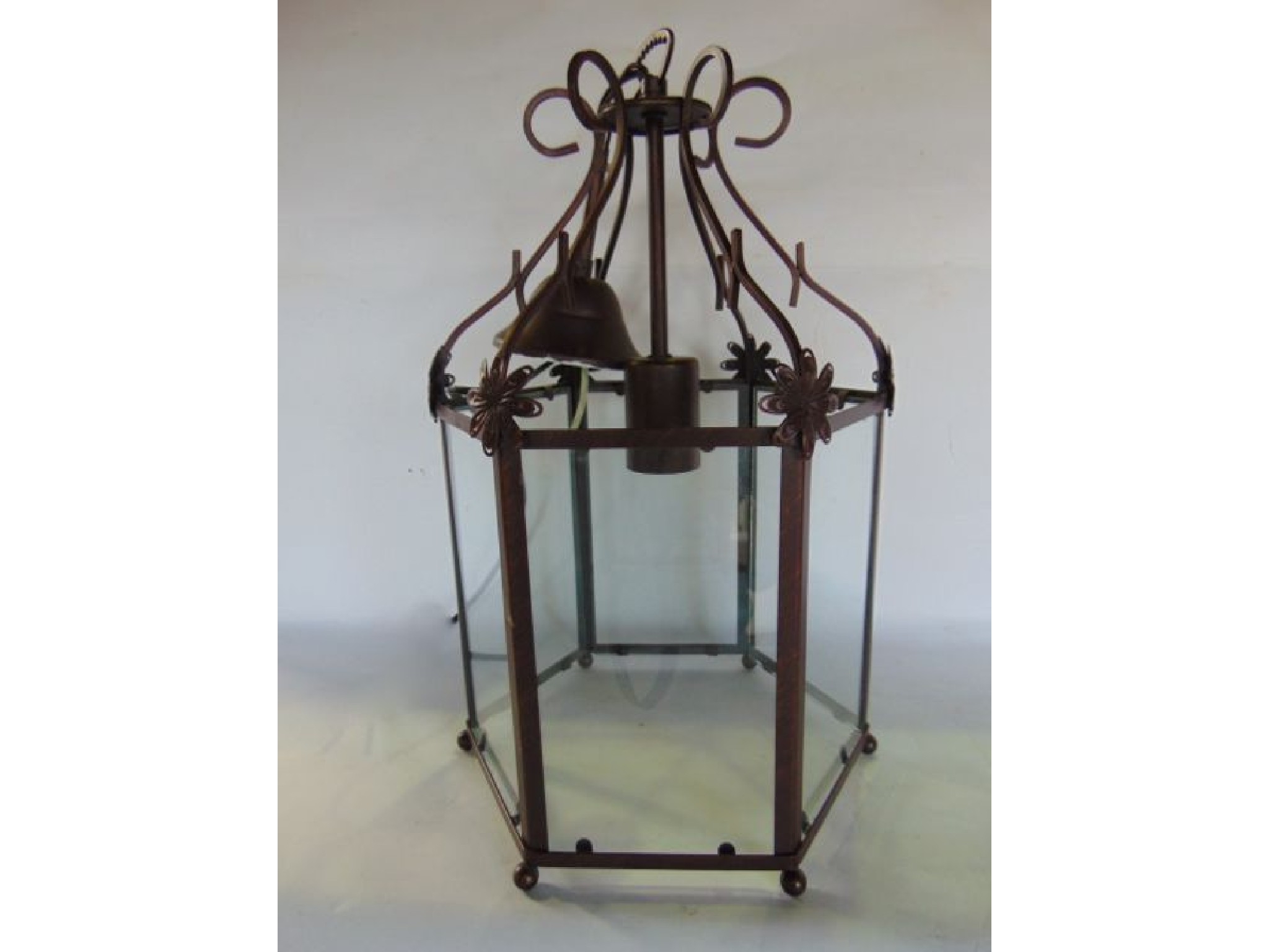 Appraisal: A single hexagonal ceiling lantern with clear glazed panelled sides