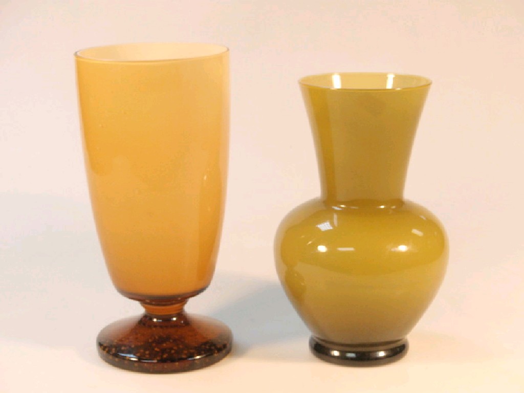 Appraisal: A thC amber cased glass vase with clear amber glass