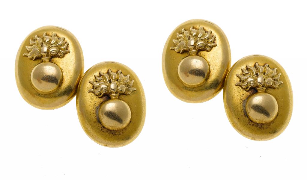 Appraisal: A PAIR OF GOLDCUFF-LINKS applied with grenade badge indistinctly marked