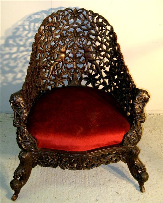 Appraisal: German armchair profusely carved with pierced decoration the back with