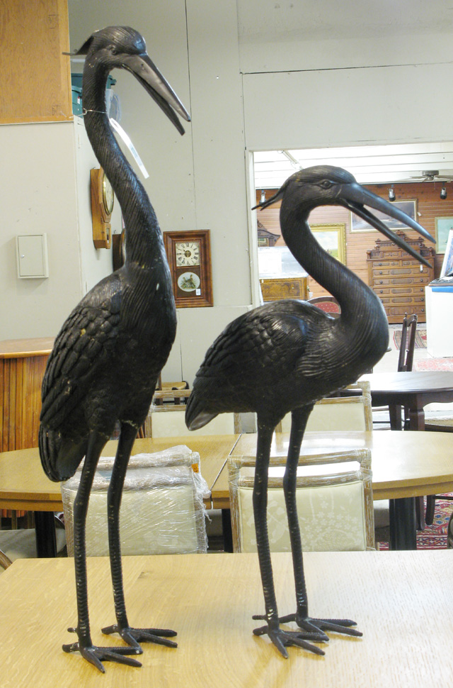 Appraisal: TWO BRONZE GARDEN HERON individually cast in unique standing poses