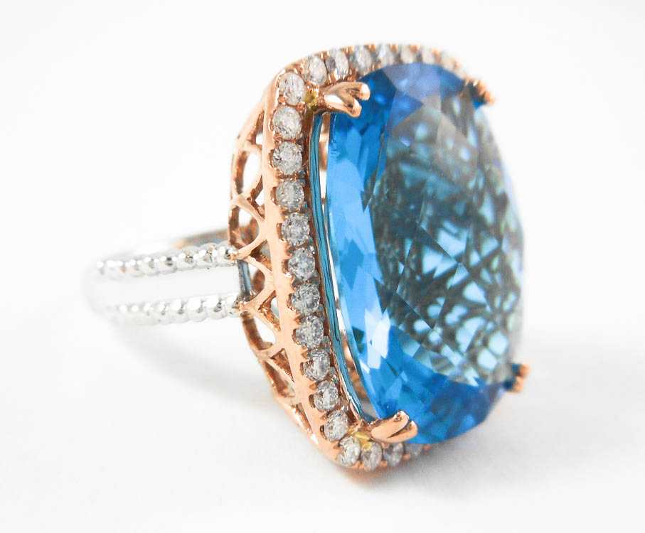 Appraisal: BLUE TOPAZ DIAMOND AND FOURTEEN KARAT GOLD RING The rose