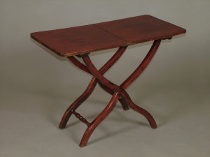 Appraisal: A mahogany coaching table th century the hinged rectangular top