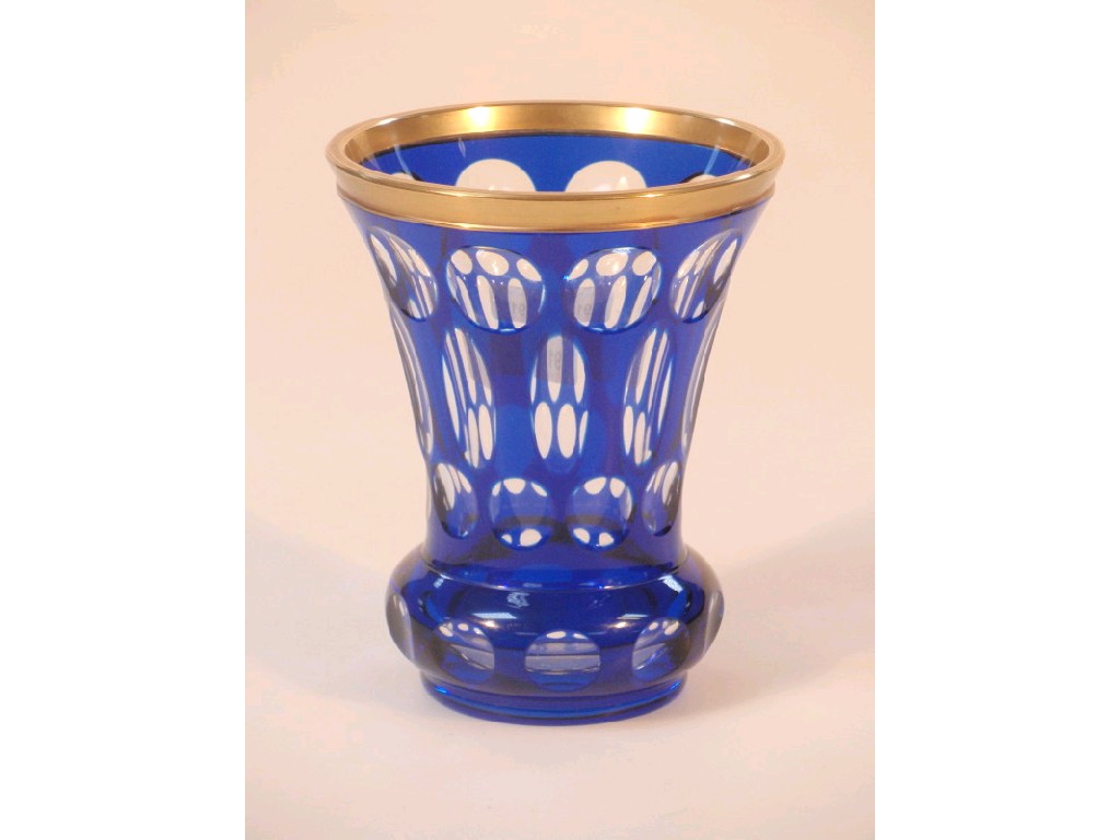 Appraisal: A blue cased glass vase with flash cut oral and