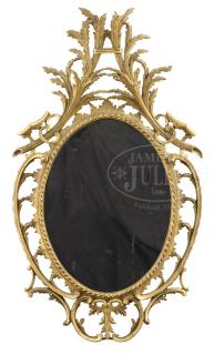 Appraisal: CHIPPENDALE TRANSITIONAL GILT WOOD LEAF CARVED OVAL MIRROR AND HEPPLEWHITE