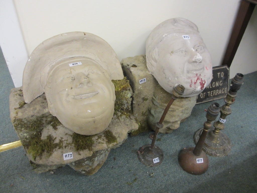 Appraisal: Two sandstone garden ornament wall masks wall sign and three