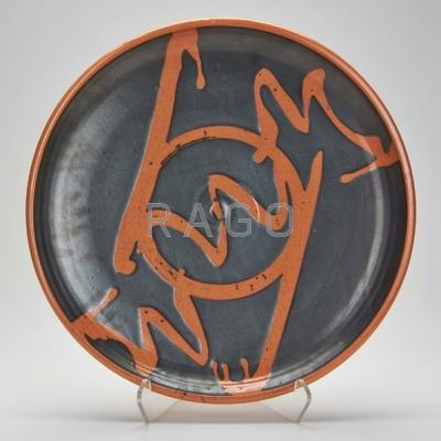 Appraisal: STUDIO Pottery charger Black and orange glaze in the Japanese