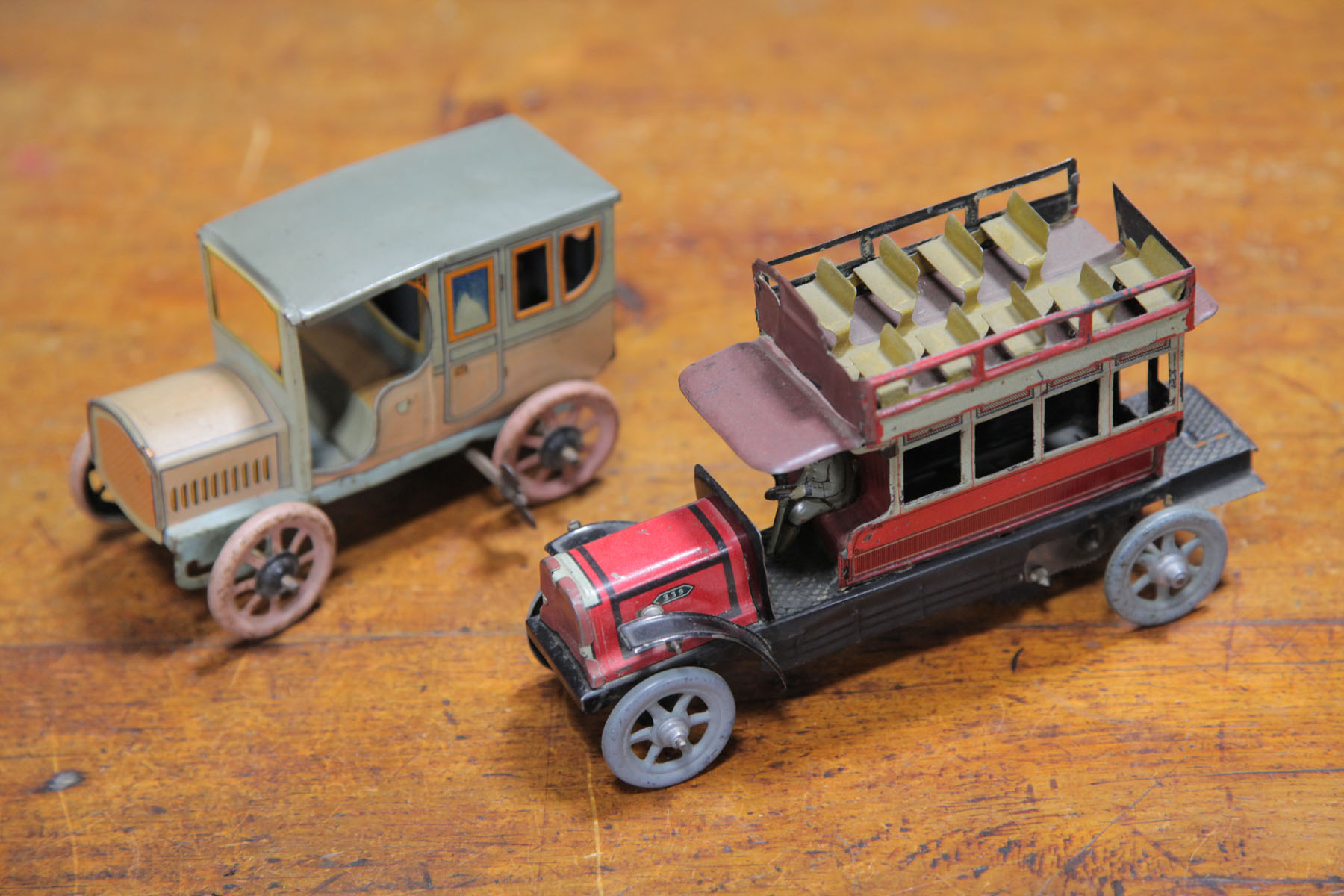 Appraisal: TWO TIN WIND-UP VEHICLES German first half of th century