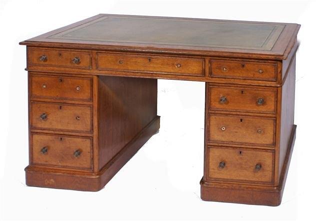 Appraisal: A Victorian oak pedestal desk with green leather inset top