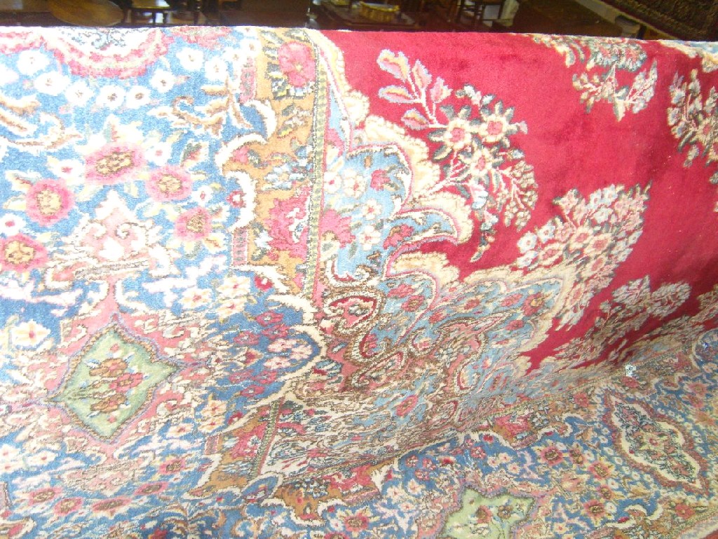 Appraisal: A large good quality heavy wool carpet in a Persian