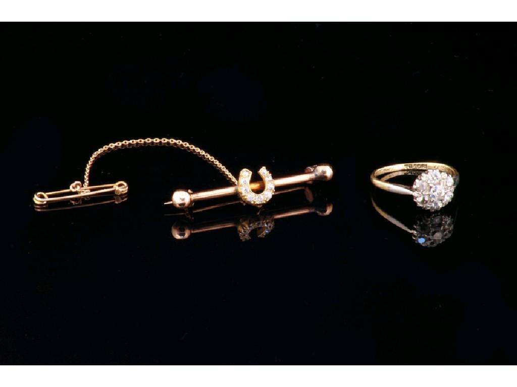 Appraisal: A UNMARKED YELLOW METAL BAR BROOCH mounted with a diamond-set