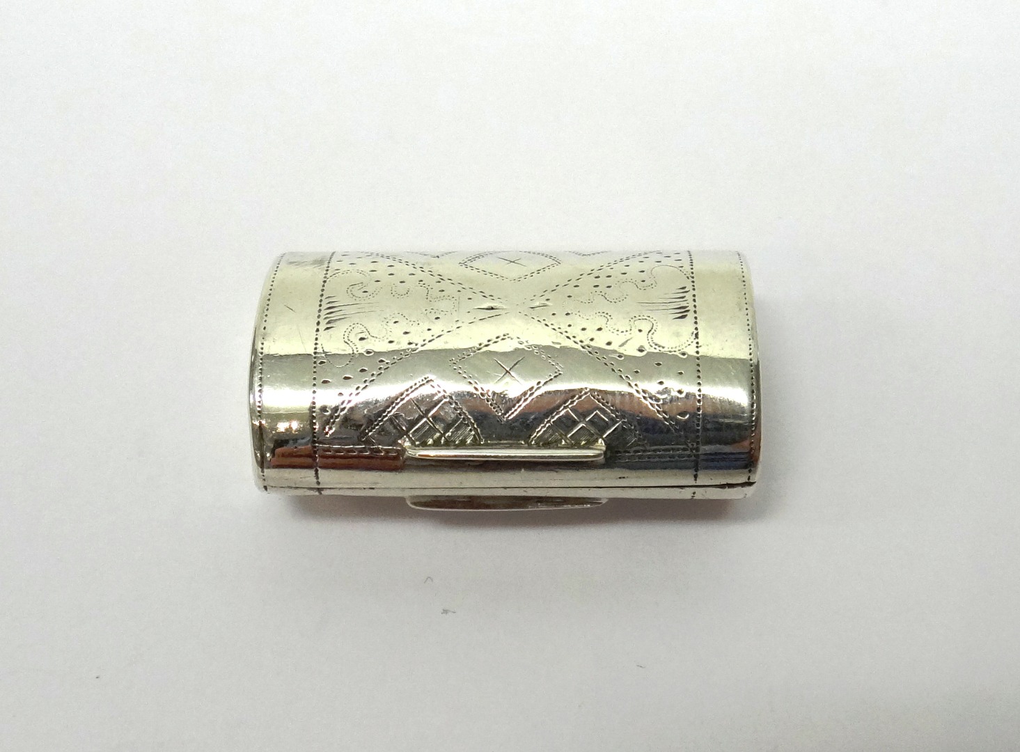 Appraisal: A George III silver vinaigrette of curved rectangular form with