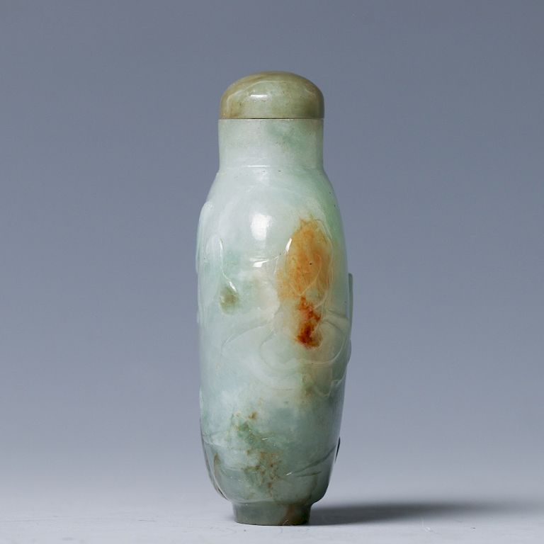 Appraisal: JADEITE STONE SCENIC CARVED SNUFF BOTTLE QING Of flattened ovoid