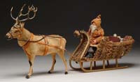 Appraisal: REINDEER CANDY CONTAINER WITH SANTA IN MOSS SLEIGH A fine