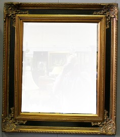 Appraisal: A Victorian style rectangular mirror the gilt and ebonised frame