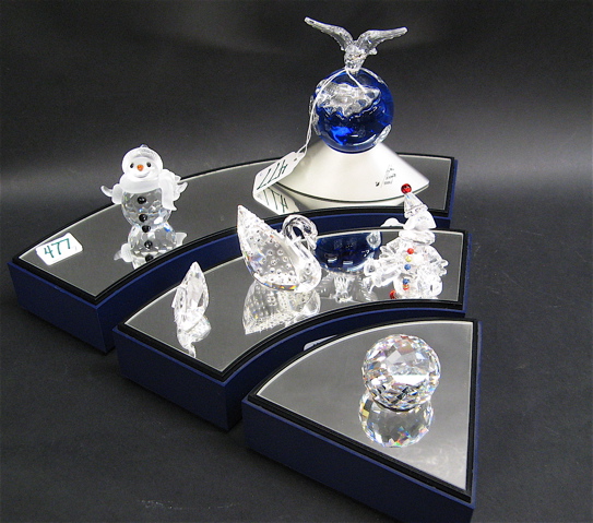 Appraisal: COLLECTION SWAROVSKI CRYSTAL DISPLAY STAND pieces The cut crystal includes