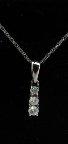 Appraisal: K White gold diamond pendant with three graduated round diamonds