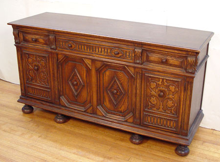 Appraisal: EARLY TH CENTURY SPANISH STYLE OAK SIDEBOARD drawers over cabinet