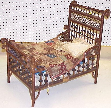 Appraisal: Doll's wicker bed with two quilts and one early pillow