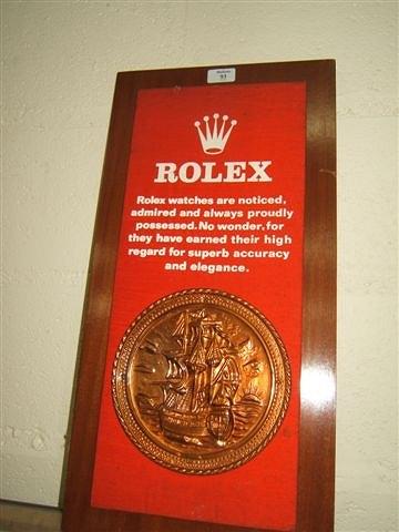 Appraisal: A Rolex shop advertising sign 'Rolex Watches are Noticed Admired