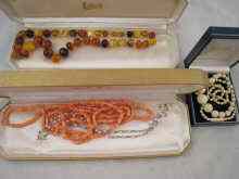 Appraisal: A mixed lot comprising an ivory graduated necklace an amber