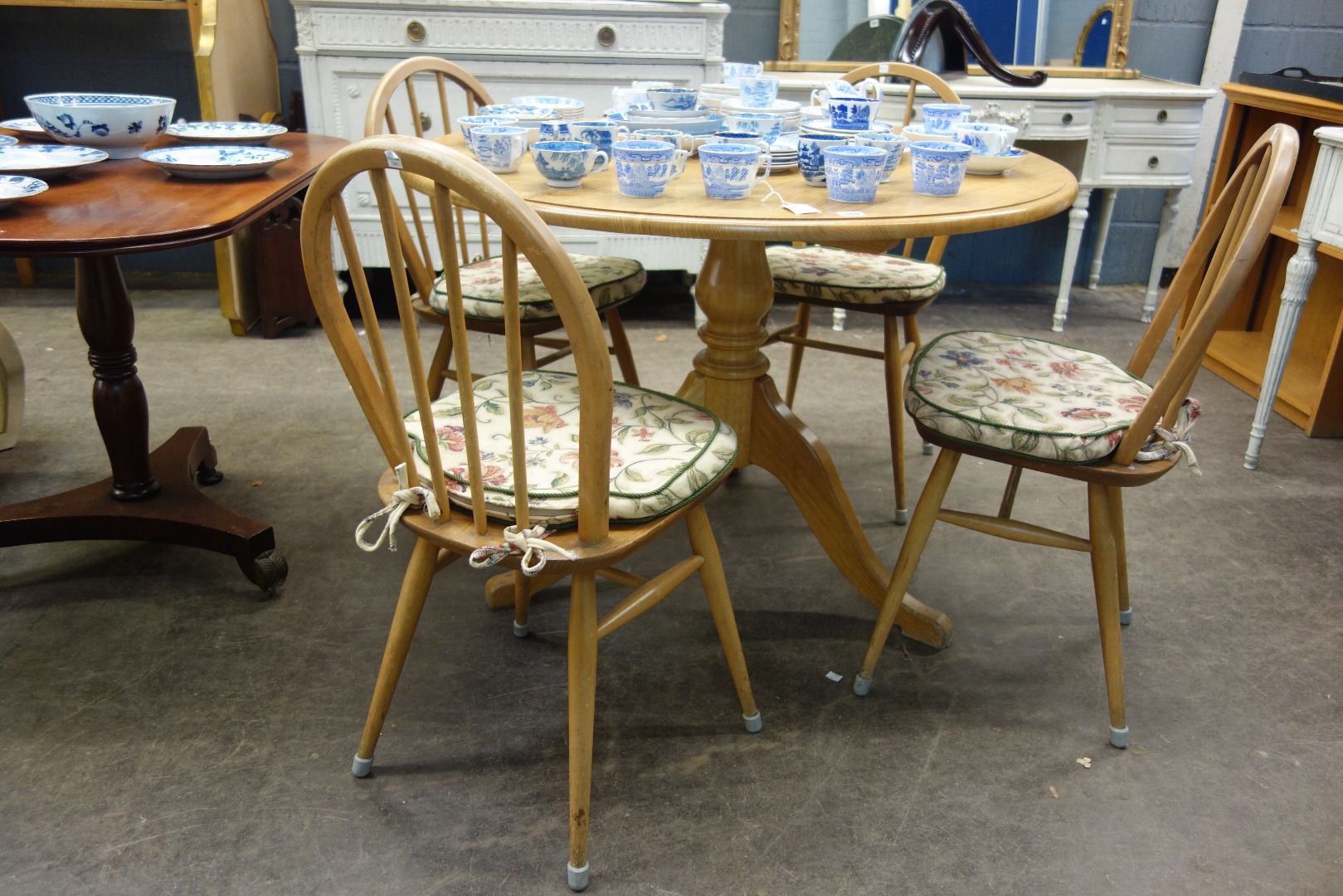 Appraisal: A reproduction George III style light oak breakfast table the