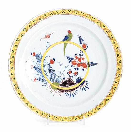 Appraisal: Delft parrot pattern charger late th century geometric yellow rim