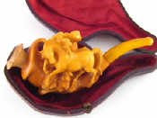 Appraisal: A meerschaum pipe carved as horses at play with amber