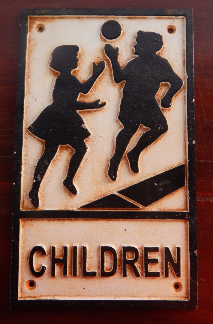 Appraisal: A cast iron Children Playing sign cm x cm