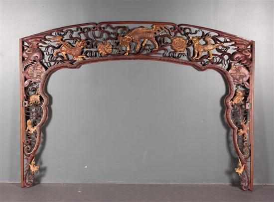 Appraisal: Chinese carved and reticulated lacquered parcel-giltwood door frame carved figures