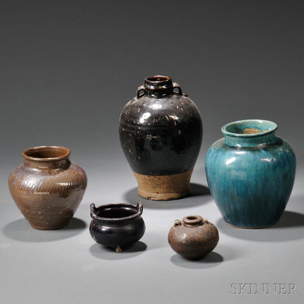 Appraisal: Five Pottery Items China a black-glaze oviform jar ht a