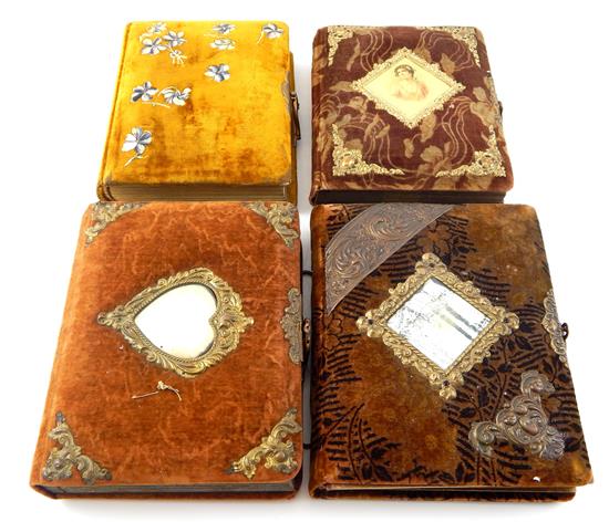 Appraisal: Four late Victorian velvet-encased photo albums first mustard colored front