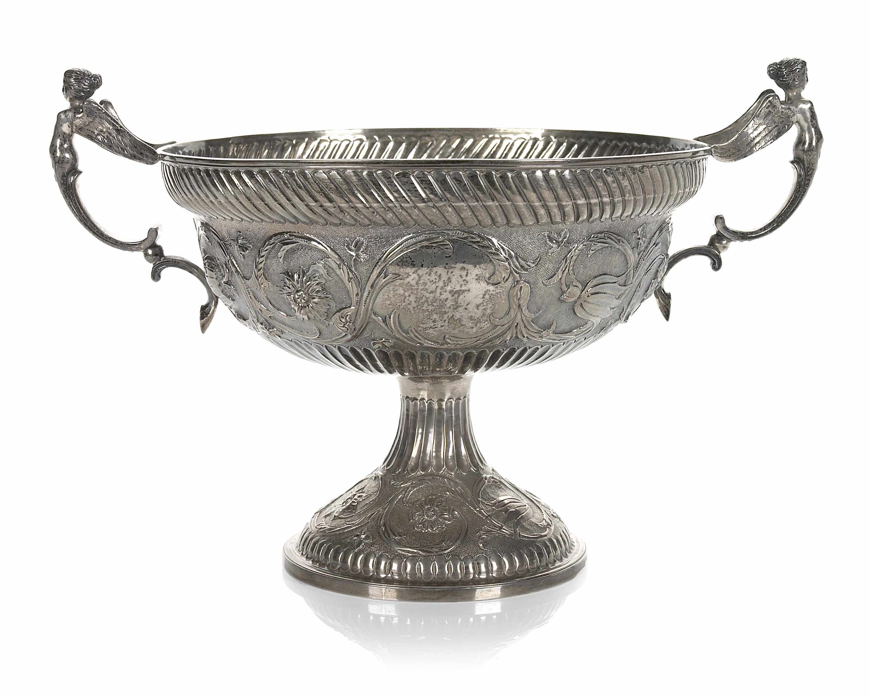 Appraisal: A silver pedestal bowl with figural handles height in oz