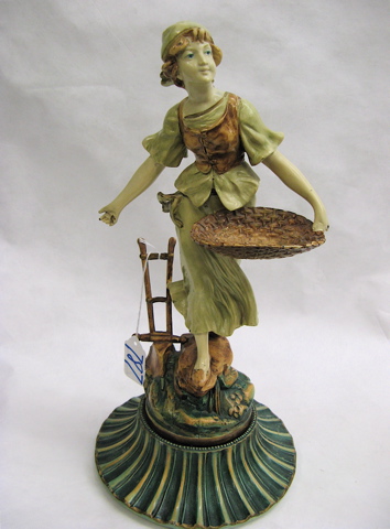 Appraisal: FRENCH PAINTED SPELTER SCULPTURE of a girl carrying a basket