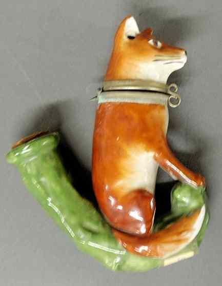 Appraisal: German porcelain pipe in the form of a seated fox