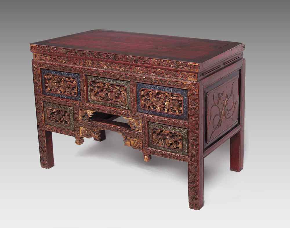 Appraisal: CHINESE CARVED CHEST Highly detailed parcel gilt and red carved