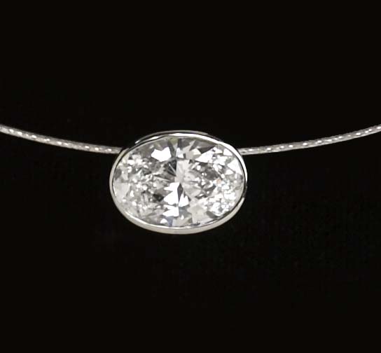 Appraisal: DIAMOND PENDANT k white gold bezel set pendent with one