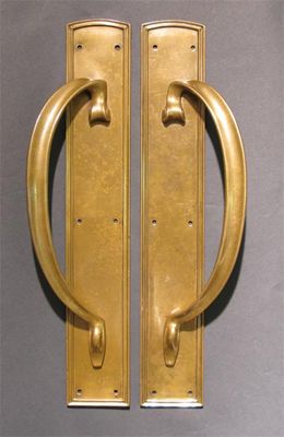 Appraisal: A pair of W T S brass door handles stamped